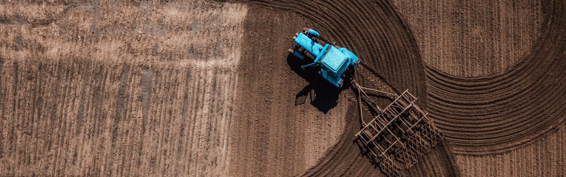 Aerial view of combine cultivating field