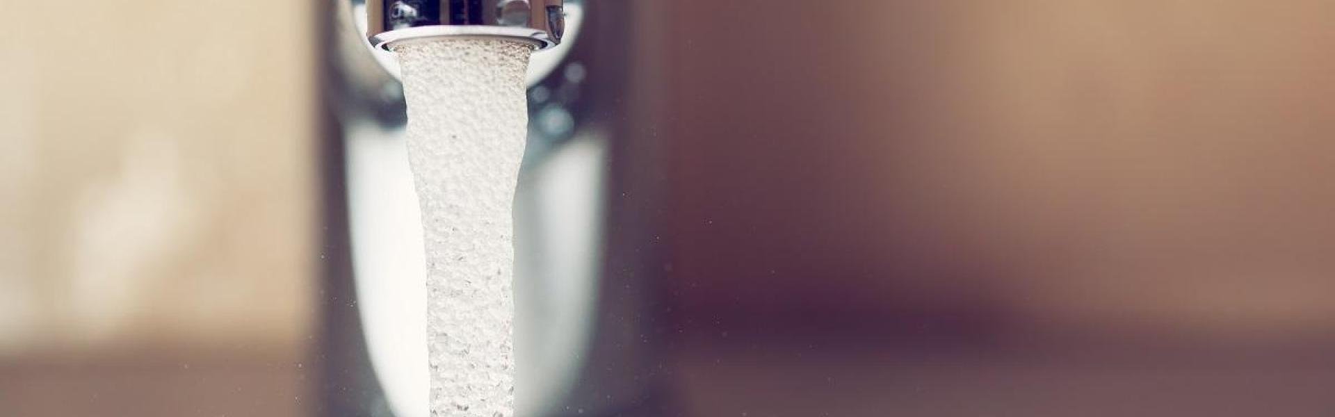 running water through a tap