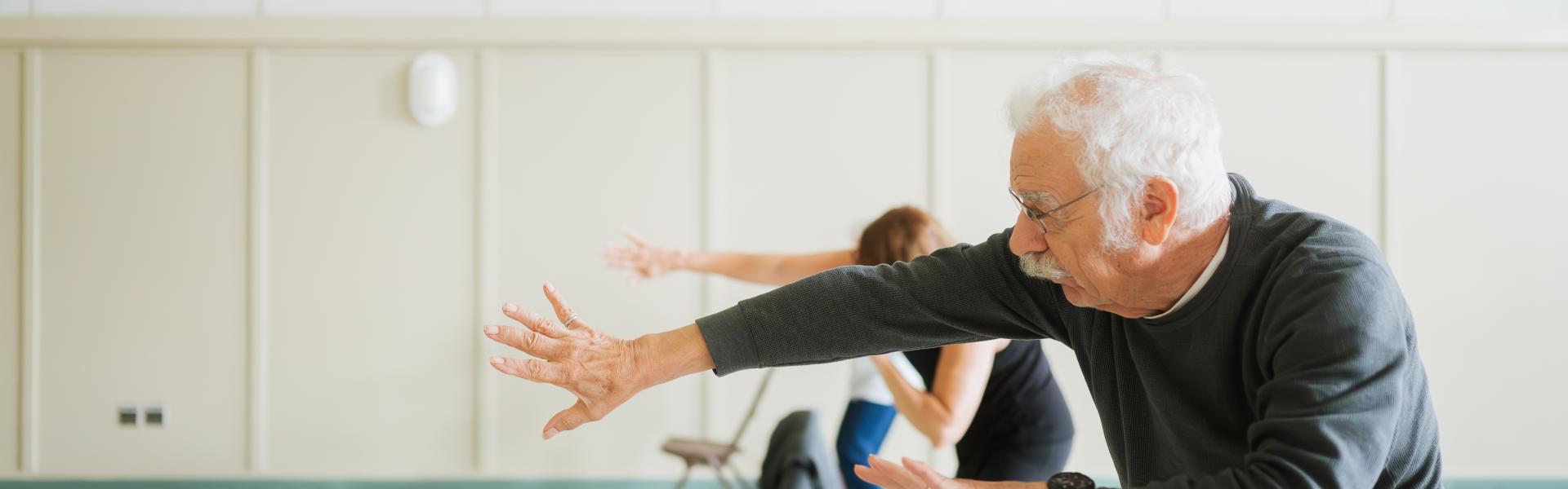 Seniors exercising in a group class