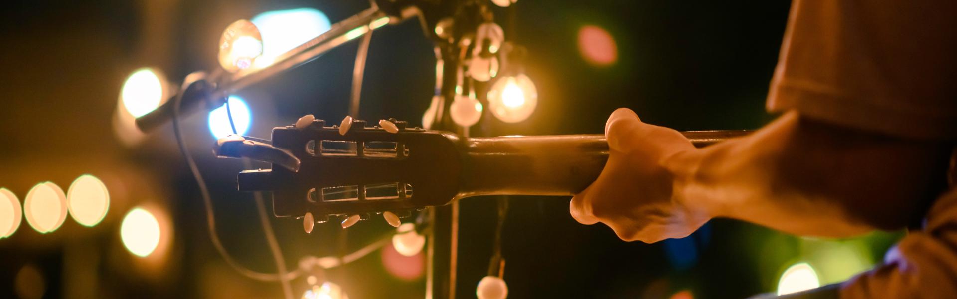 A person playing guitar.