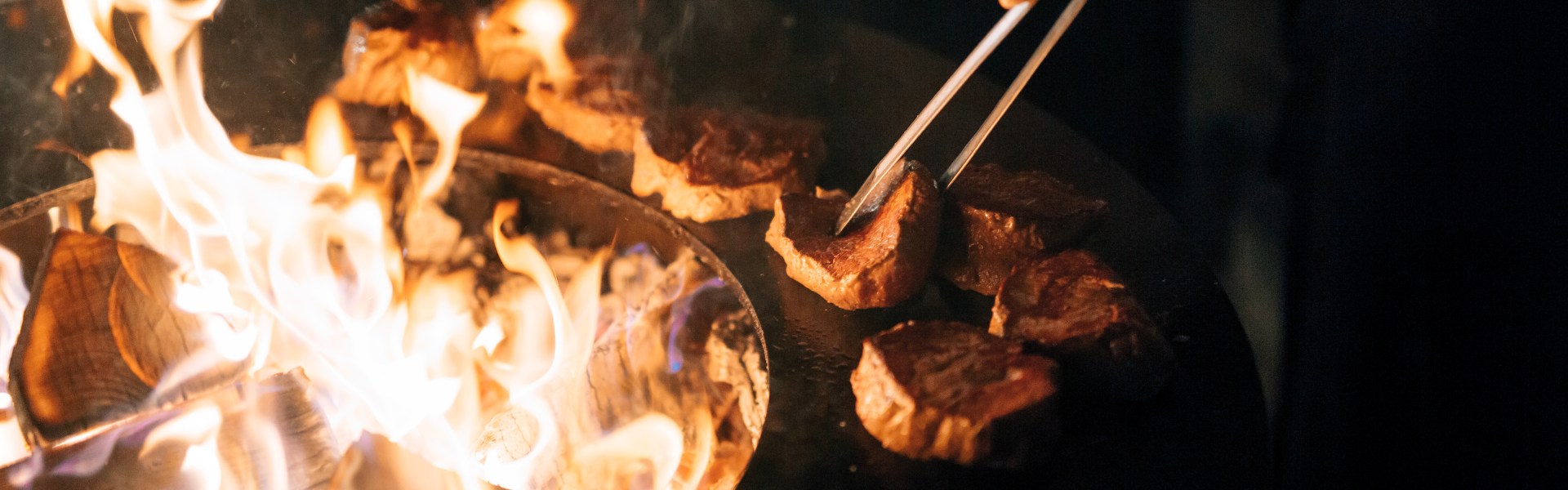 chef cooking over a fire