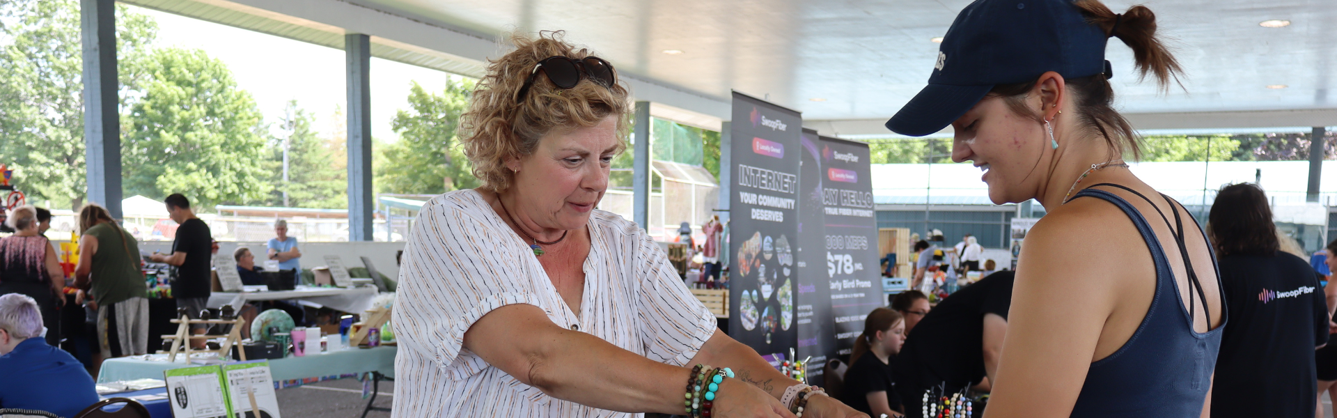 Vendor showing their product to a customer