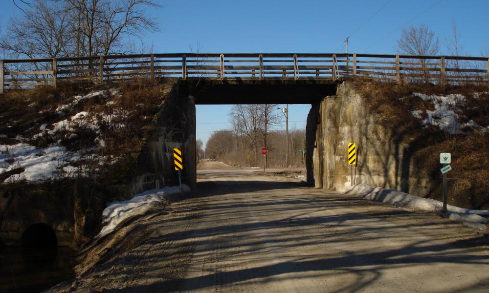 A historic bridge brining the Tiny Trail overhead of Concession 2 East