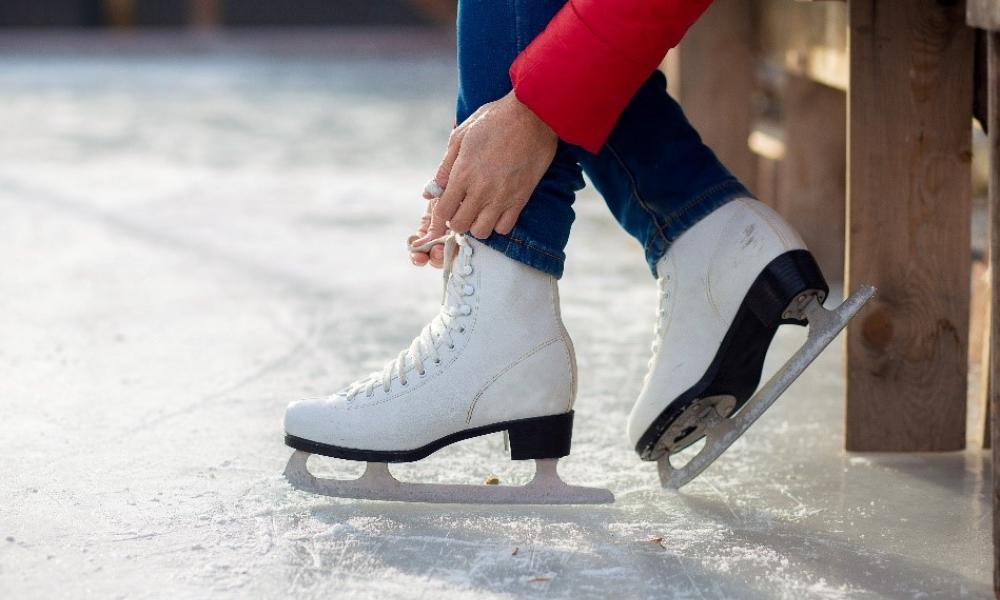 Some tying their figure skates.
