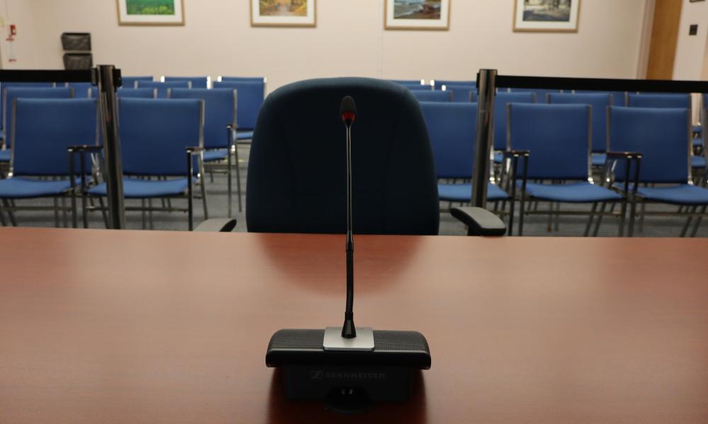 deputation microphone and chair with the council chambers gallery in the background