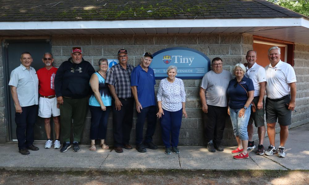 Members of Council, the Parks and Recreation Advisory Committee, Larry Patenaude and some of their family and friends posing with the newly unveiled Toanche Park Larry Patenaude Ball Diamond sign