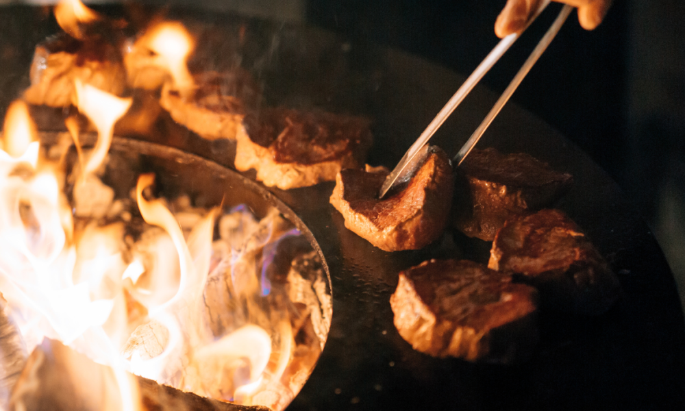 chef cooking over a fire