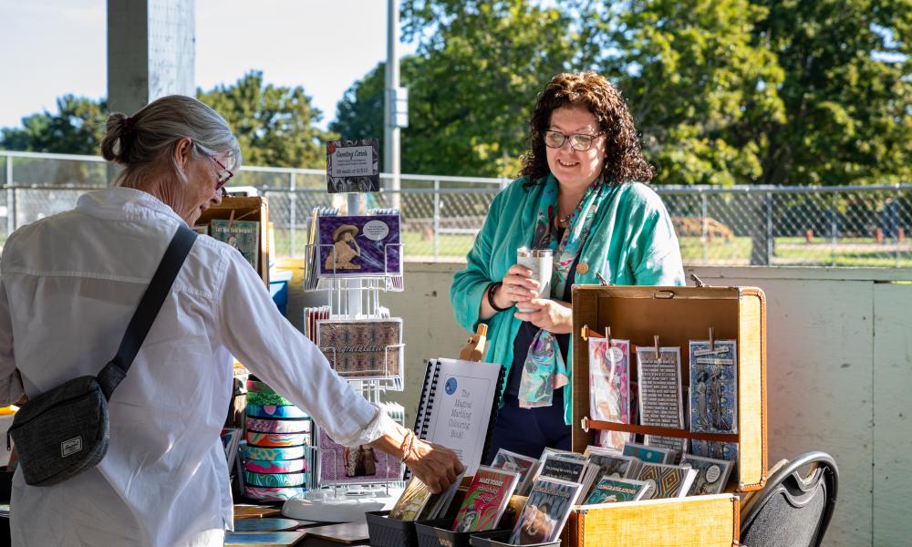 Vendor showing their product to a customer