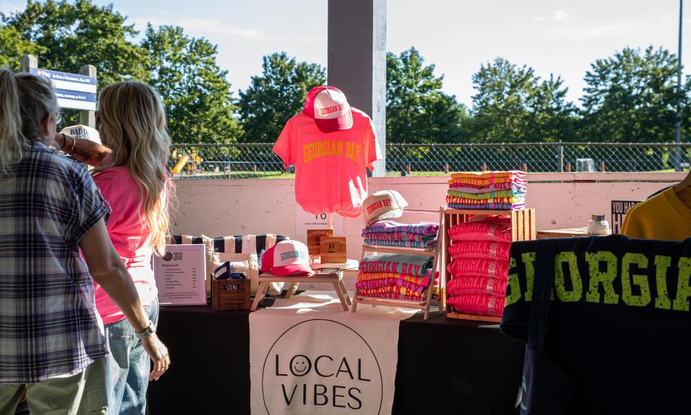 Vendor showing their product to a customer