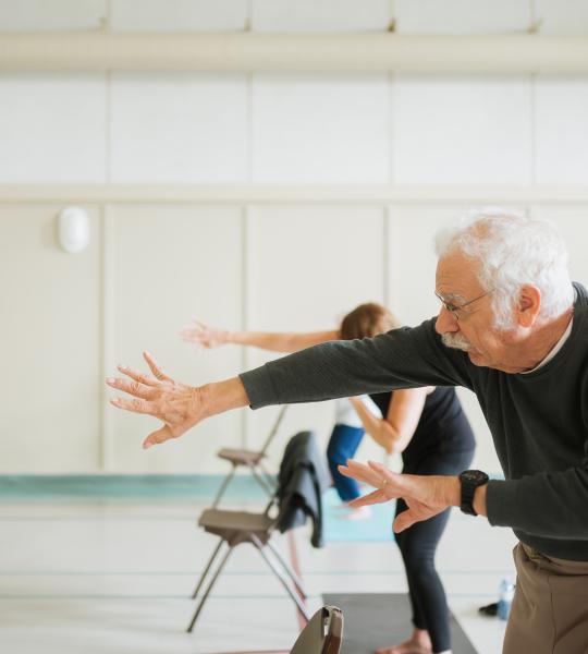 Seniors exercising in a group class