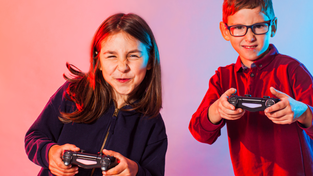 Two kids holding gaming remotes