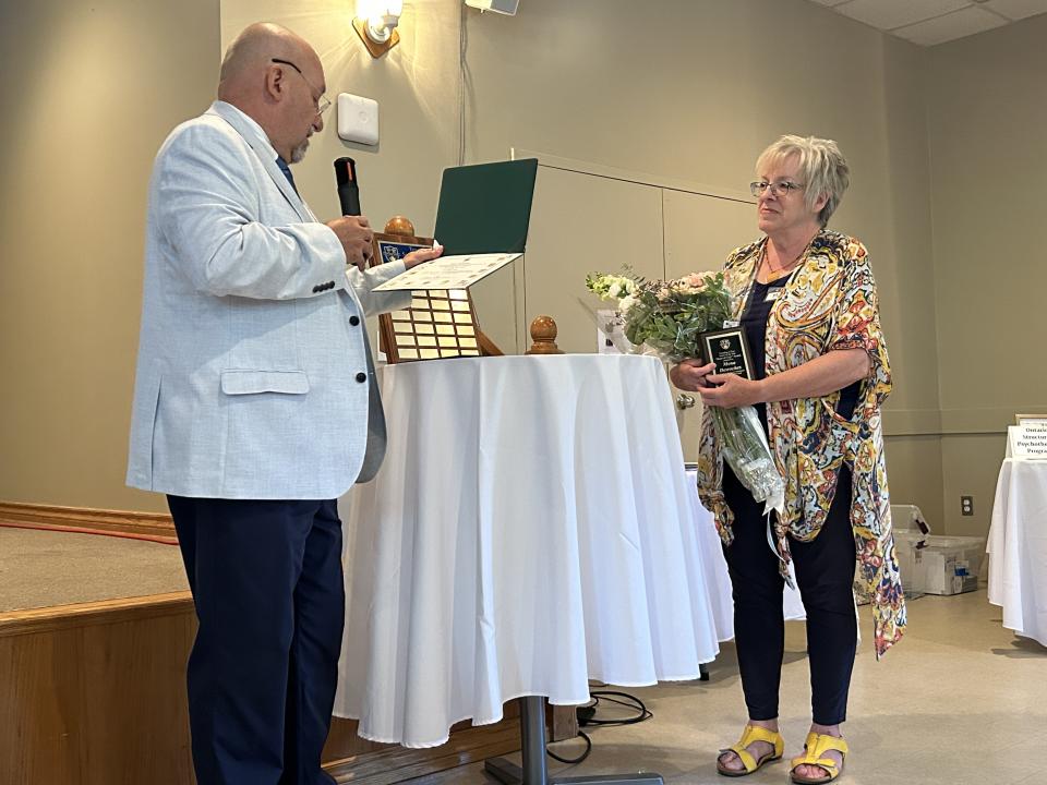 Councillor Helowka presenting the Senior of the Year award to Mona Desroches