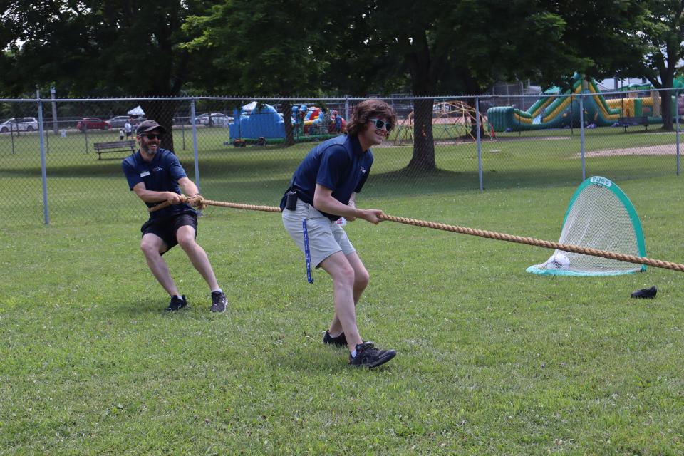 staff participating in the tug of war game