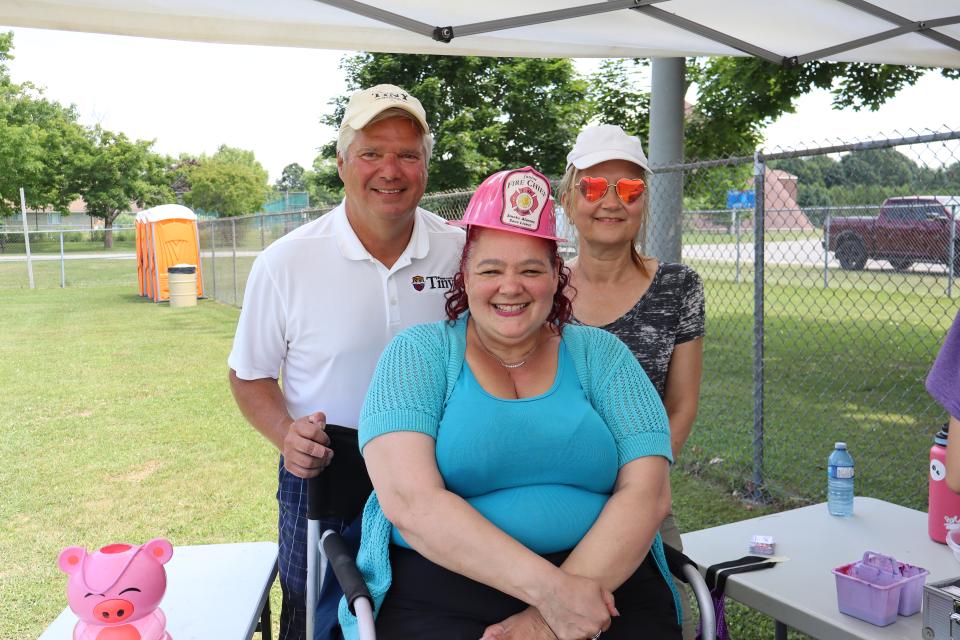 Mayor David Evans with residents waiting to get their face painted