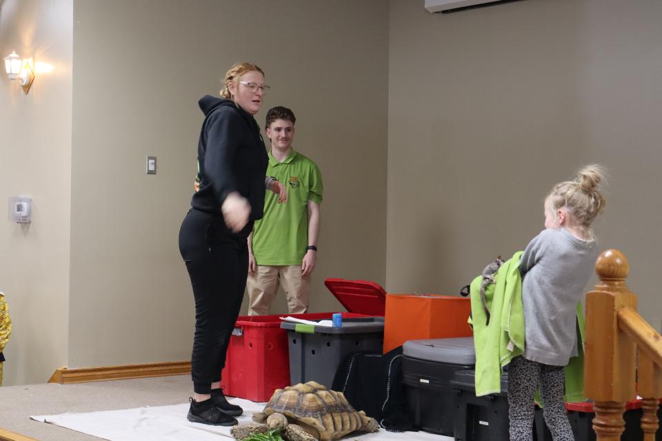 Sugar glider landed on a towel a young girl is holding after it jumped through the air from the Zoo to You staff