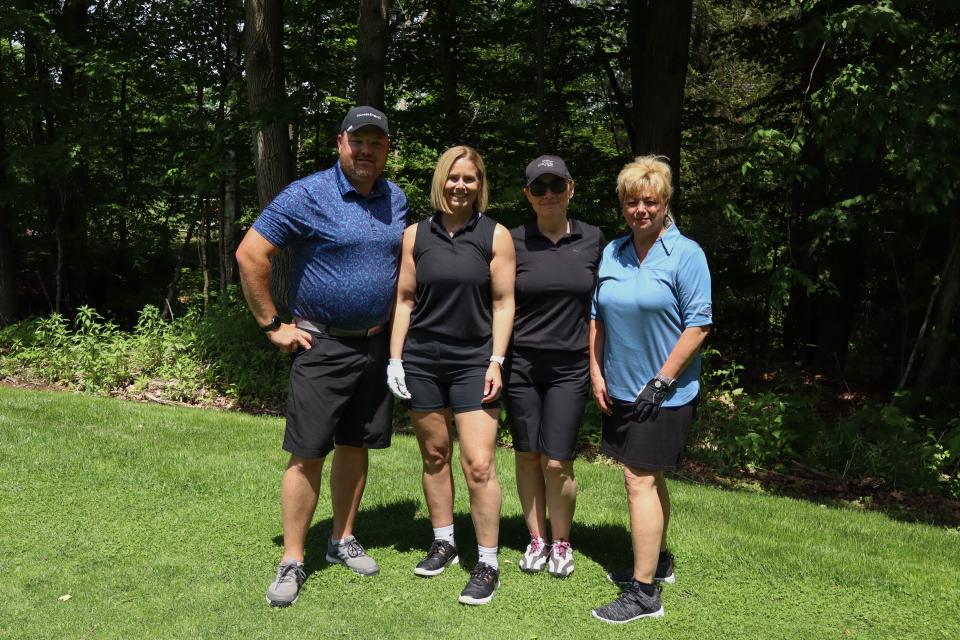 Golf foursome posing together