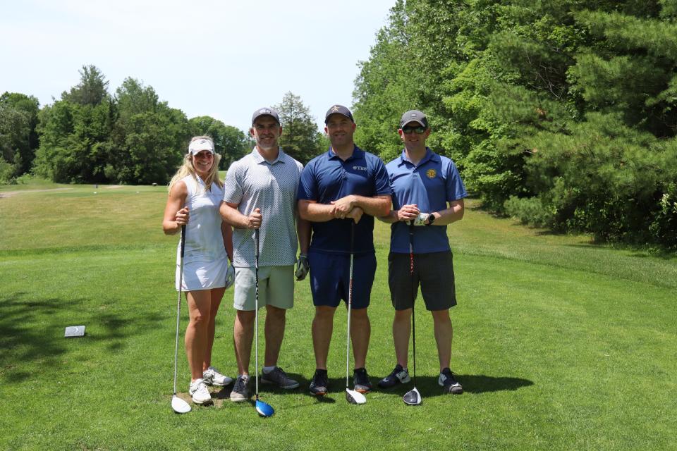 Golf foursome posing together including Councillor Steffen Walma