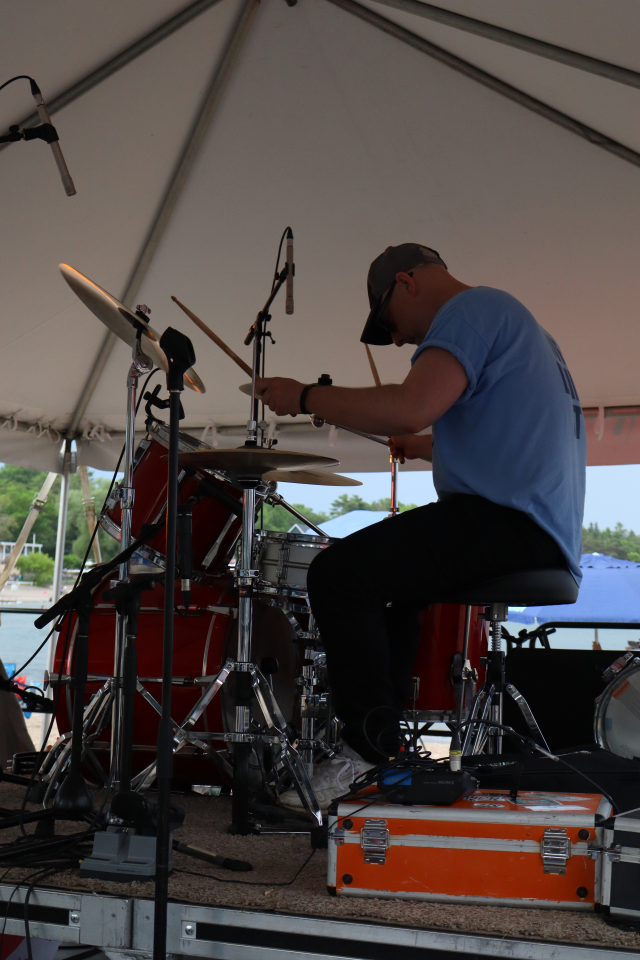 Drummer for The Rick Robichaud Band performing on stage.