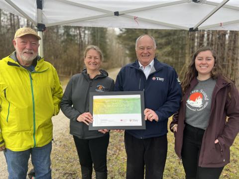Photo of Councillor John Bryant, Julie Cayley, Executive Director, Severn Sound Environmental Association (SSEA), Mayor George Cornell, and Shannon Mawhinney, Watershed Resilience Coordinator, SSEA