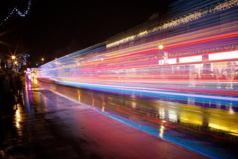 Long exposure showing light trails from holiday parade at a light parade