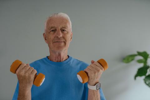 senior man lifting weights
