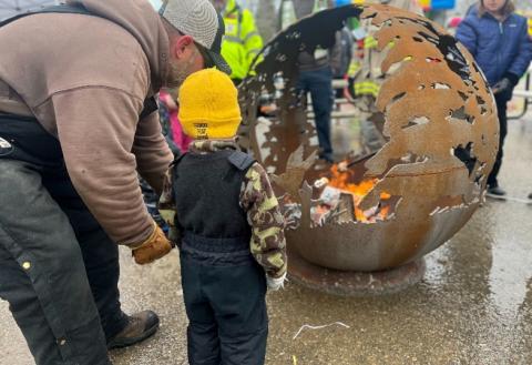 image of father and sun roasting marshmallows at carnaval d'hiver