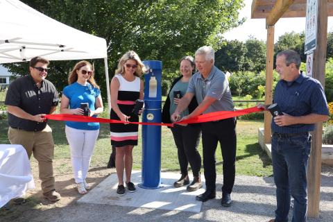 image of MPP Jill Dunlop, Mayor Evans, and staff at a ribbon cutting for new accessible water fill stations