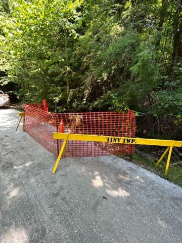 Image of yellow barrier with Township of Tiny writing 