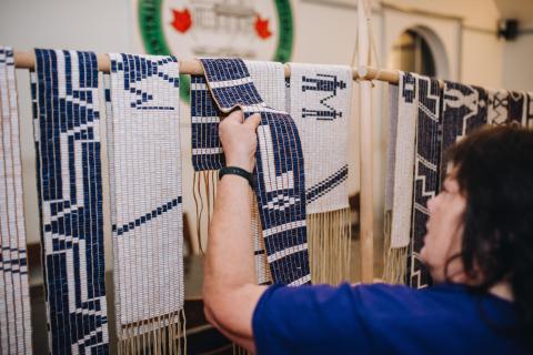 A person looking at Indigenous art