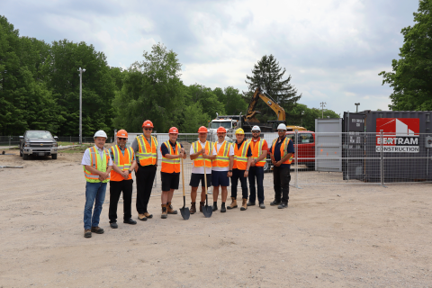 Members of Council, staff, and representatives from Bertram Construction pose for a photo in front of construction of the new Toanche Pavilion in Toanche Park