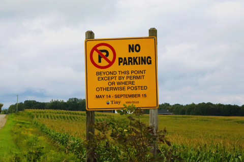 Township of Tiny parking permit sign indicating permits are required from May 14 to September 15