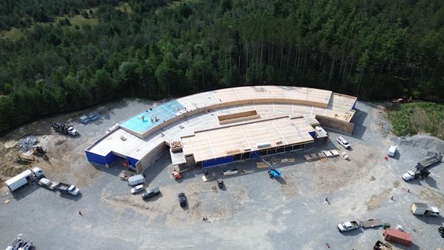 Aerial view of the Township of Tiny Administrative Centre under construction with crews working on the roof