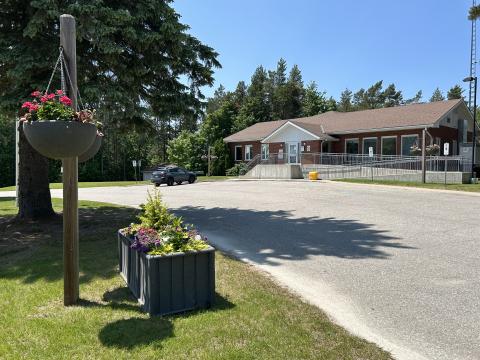 View of the Township of Tiny Office in the distance, showing the driveway and planters in the forefront